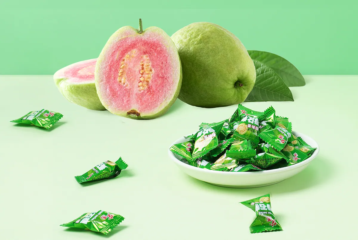 Cut pink guava and a dish of wrapped Hongyuan guava candies