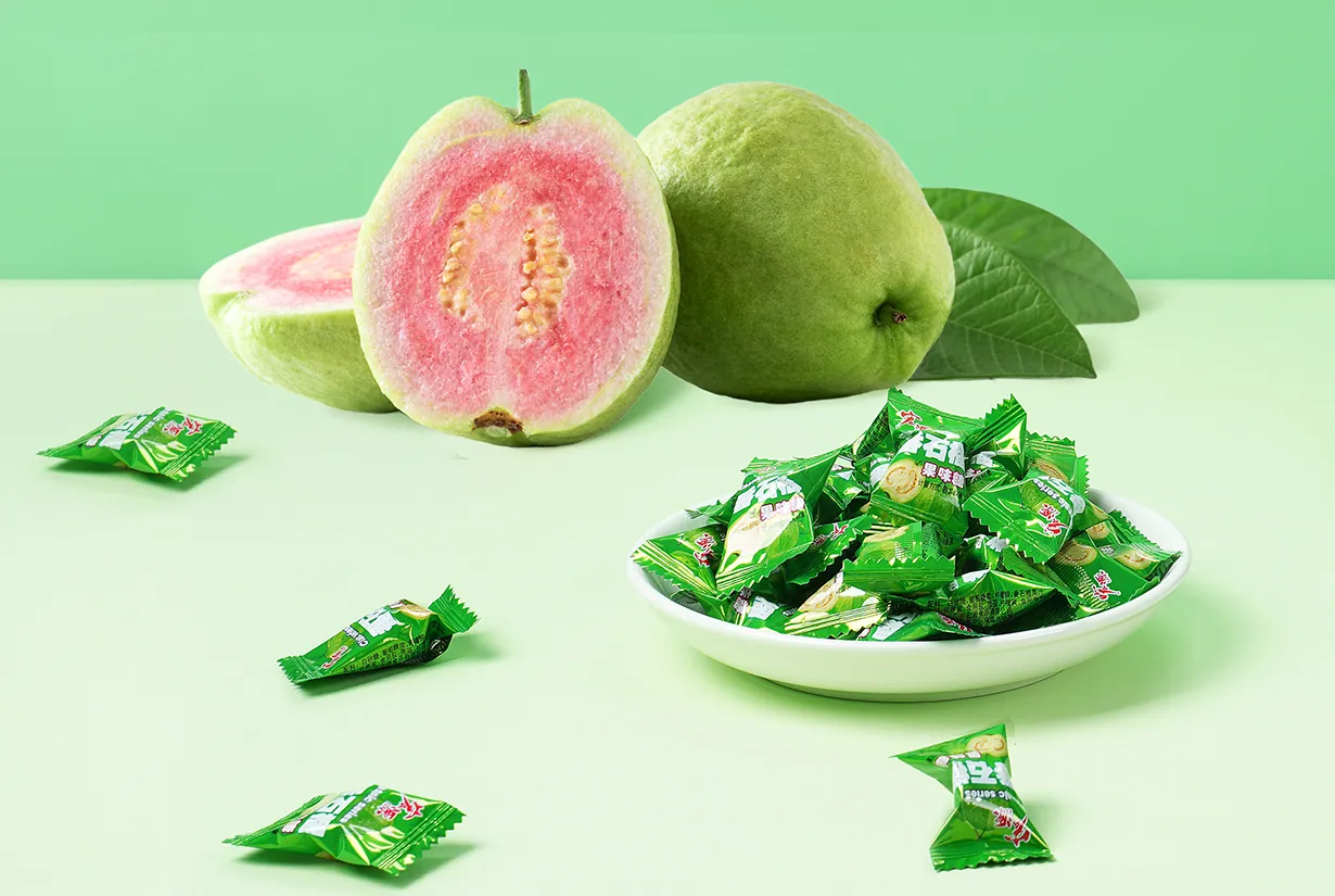 Cut pink guava and a dish of wrapped Hongyuan guava candies